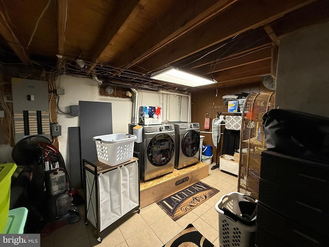 laundry room with light tile patterned flooring, laundry area, and independent washer and dryer