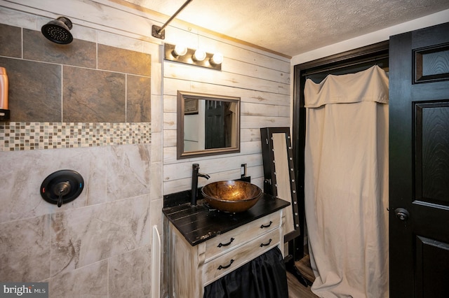 89 Cindys Way, Front Royal, VA 22630 - full bath featuring vanity, wood walls, wood finished floors, tiled shower, and a textured ceiling