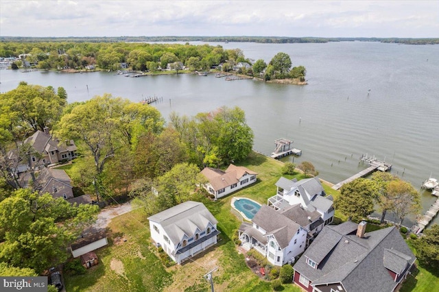 birds eye view of property featuring a residential view and a water view