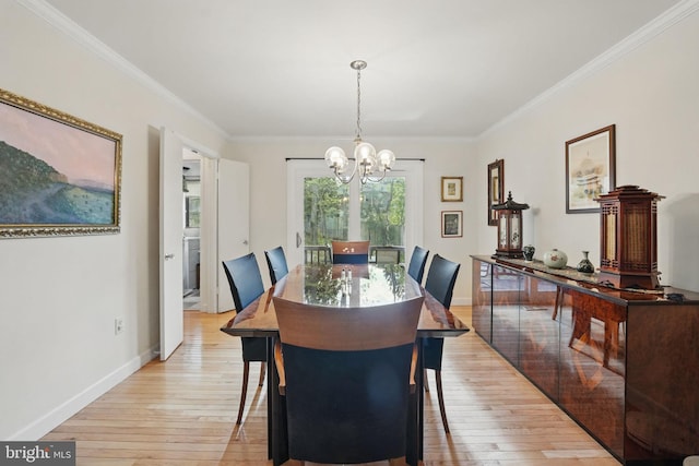 9601 Tinsmith Ln, Burke, VA 22015 - dining room featuring a chandelier, ornamental molding, and light wood finished floors