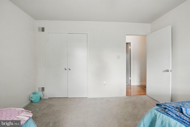 9601 Tinsmith Ln, Burke, VA 22015 - carpeted bedroom with visible vents and a closet