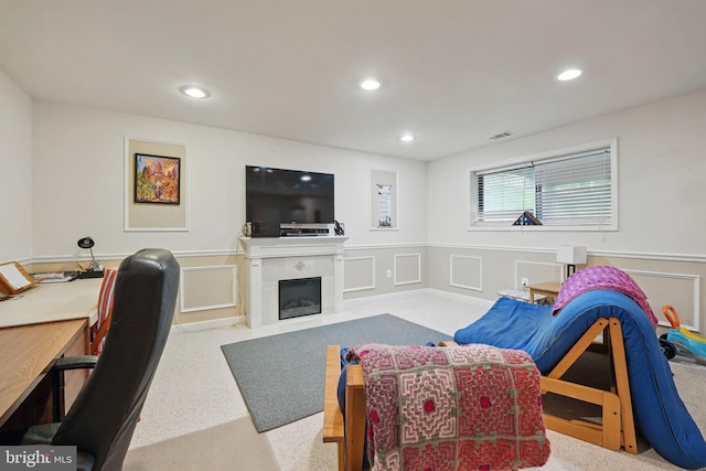 9601 Tinsmith Ln, Burke, VA 22015 - carpeted living area featuring recessed lighting, a wainscoted wall, and a tiled fireplace