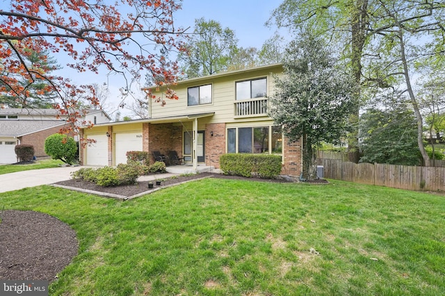 9601 Tinsmith Ln, Burke, VA 22015 - traditional-style house featuring a garage, a front lawn, fence, brick siding, and driveway