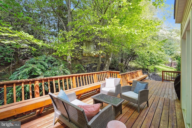 deck featuring outdoor lounge area