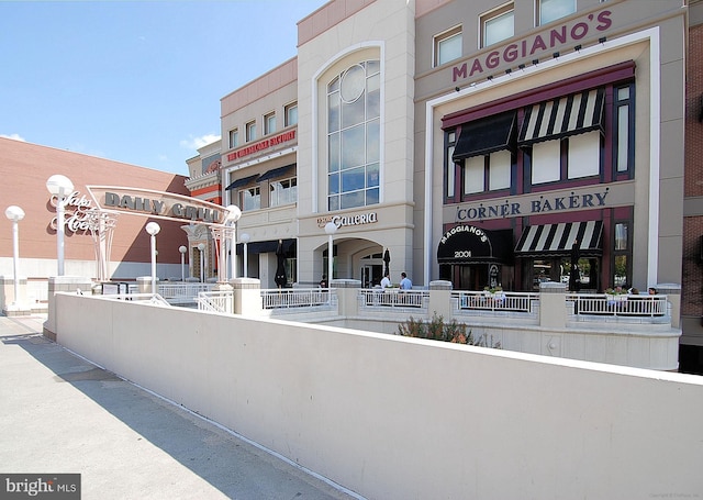 view of building exterior featuring fence
