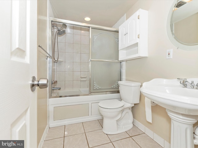 10924 Rawley Rd, New Market, MD 21774 - full bath with baseboards, tile patterned floors, toilet, and combined bath / shower with glass door