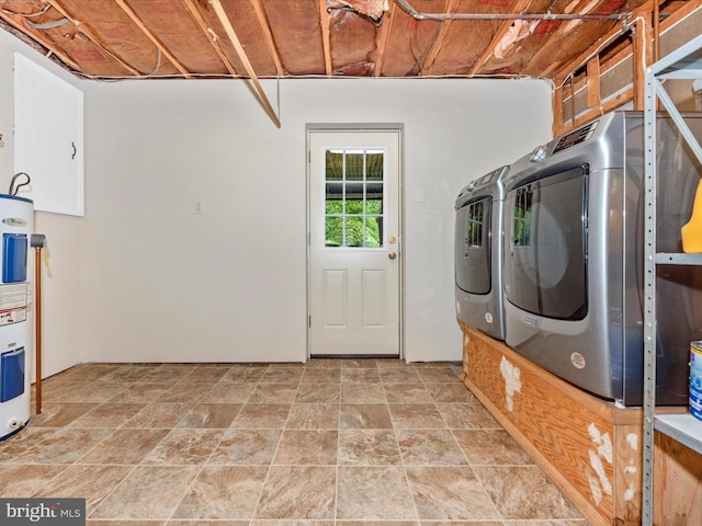 10924 Rawley Rd, New Market, MD 21774 - clothes washing area with water heater, light stone finish flooring, and washing machine and clothes dryer