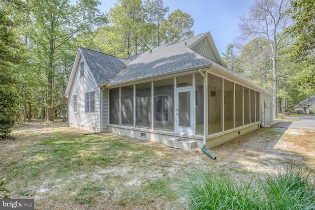 view of property exterior with a sunroom, roof with shingles, and crawl space