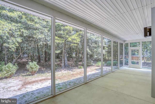 unfurnished sunroom with healthy amount of natural light