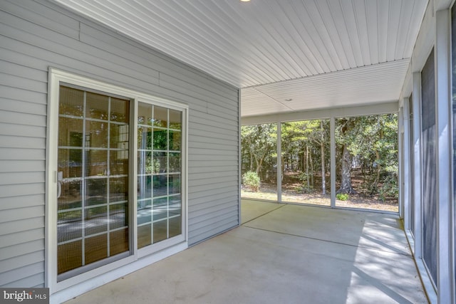 unfurnished sunroom with healthy amount of natural light