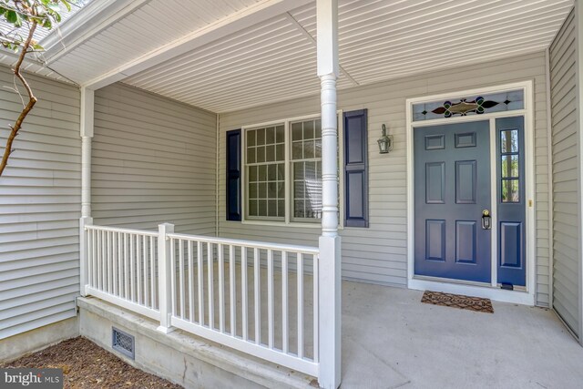 entrance to property with covered porch