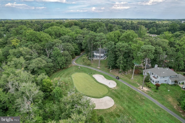 aerial view of a heavily wooded area and a local golf course
