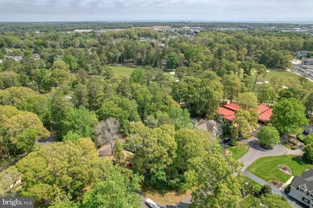 aerial view of property's location with a forest