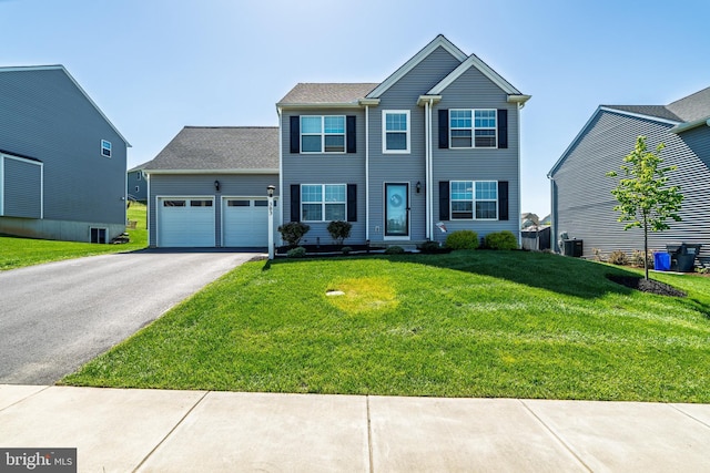 view of front facade featuring a garage, aphalt driveway, a front yard, and cooling unit
