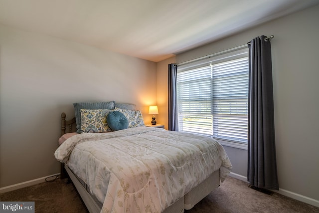 carpeted bedroom with baseboards