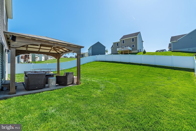 view of yard with a gazebo, a fenced backyard, and a patio area