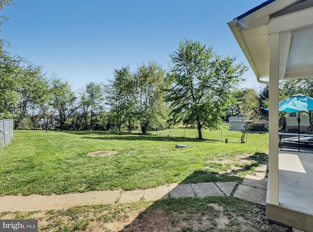 view of yard featuring a patio area and fence