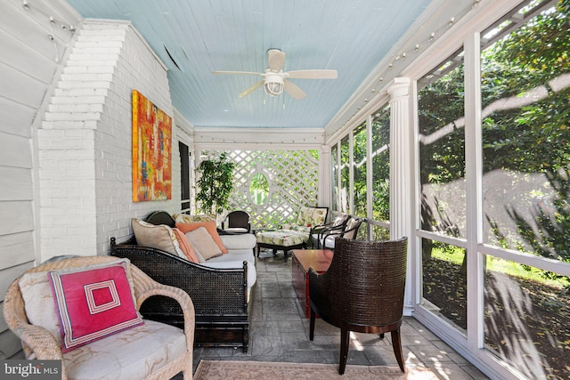 sunroom / solarium with outdoor lounge area and ceiling fan