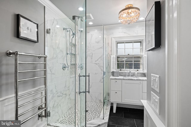full bathroom with a marble finish shower, a chandelier, vanity, ornamental molding, and recessed lighting