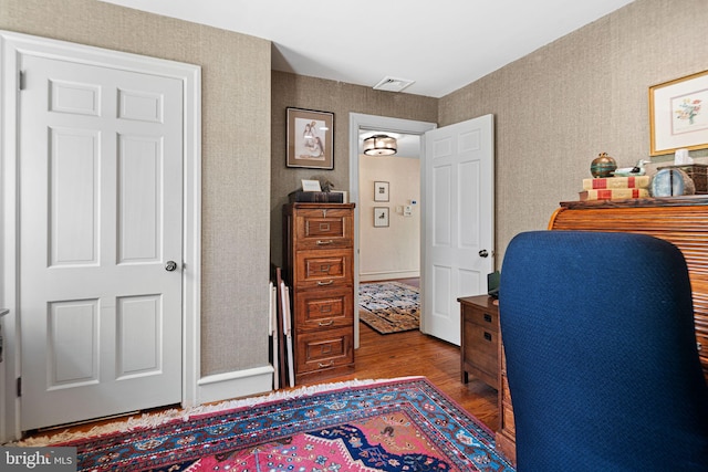 home office with wood finished floors