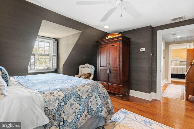 bedroom featuring light wood-type flooring, baseboards, ceiling fan, and recessed lighting