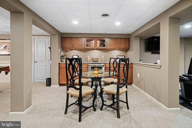 dining area with light carpet, baseboards, and recessed lighting