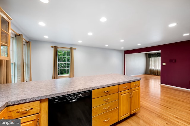 5303 Dew Garth, Baltimore, MD 21206 - kitchen with light wood-type flooring, recessed lighting, dishwasher, light countertops, and glass insert cabinets