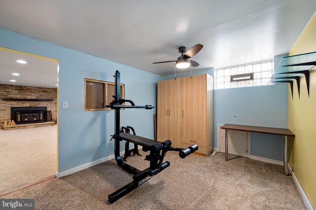 5303 Dew Garth, Baltimore, MD 21206 - workout area featuring a fireplace, carpet flooring, baseboards, and a ceiling fan