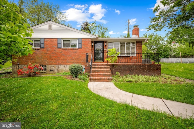 5303 Dew Garth, Baltimore, MD 21206 - view of front of home with a front lawn, brick siding, a chimney, and fence