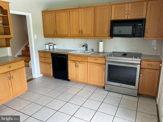 kitchen featuring light tile patterned floors, decorative backsplash, open shelves, a sink, and black appliances