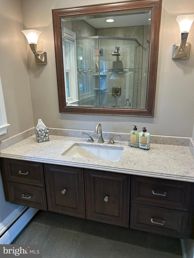 bathroom featuring vanity and a stall shower