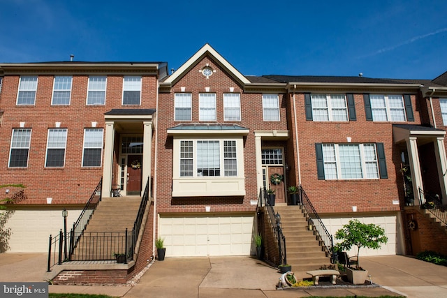 20636 Muddy Harbour Sq, Sterling, VA 20165 - view of property with stairway and an attached garage