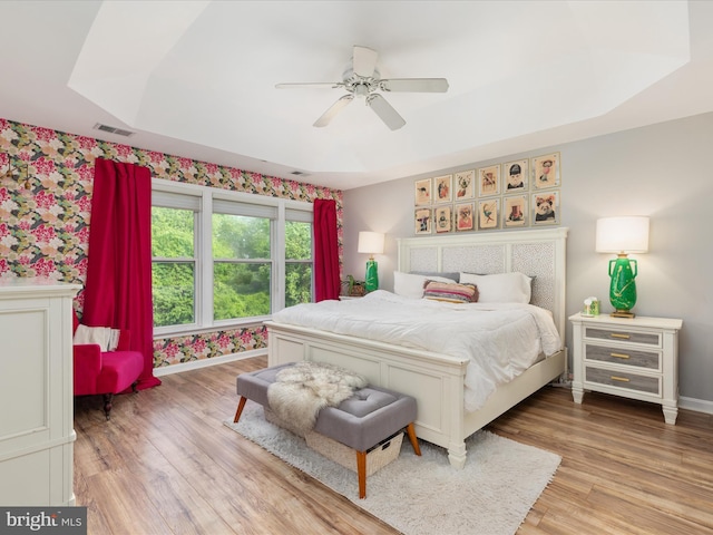 20636 Muddy Harbour Sq, Sterling, VA 20165 - bedroom featuring wallpapered walls, light wood-style flooring, baseboards, and ceiling fan