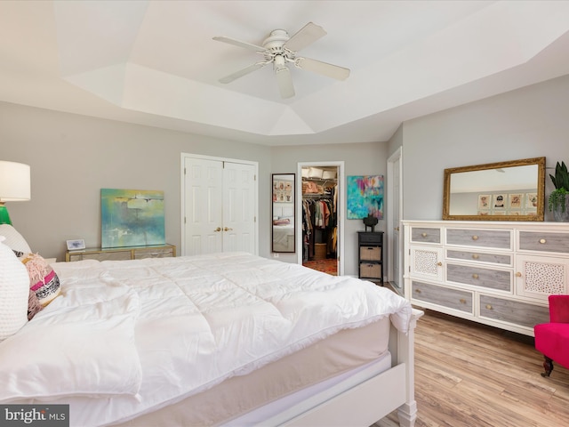 20636 Muddy Harbour Sq, Sterling, VA 20165 - bedroom with a raised ceiling, wood finished floors, ceiling fan, and a spacious closet