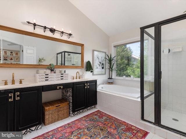20636 Muddy Harbour Sq, Sterling, VA 20165 - full bathroom with tile patterned floors, vaulted ceiling, a stall shower, a bath, and double vanity