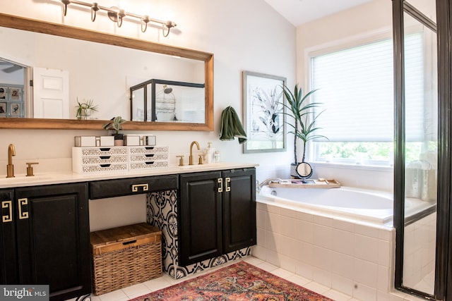 20636 Muddy Harbour Sq, Sterling, VA 20165 - full bathroom featuring tile patterned floors, double vanity, a bath, and a stall shower