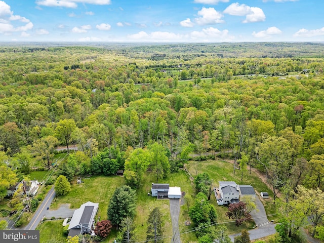 drone / aerial view featuring a view of trees