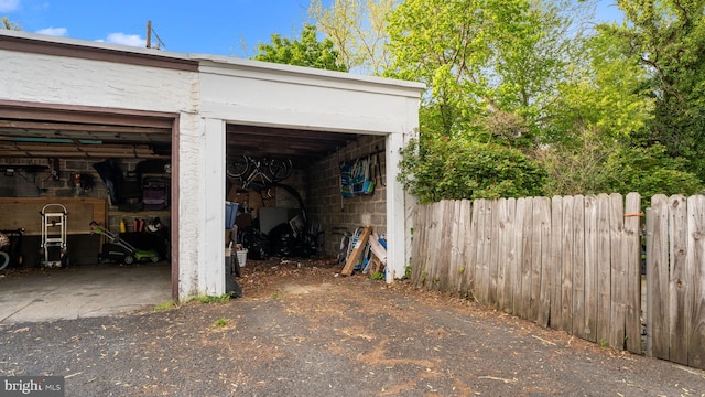 garage featuring fence