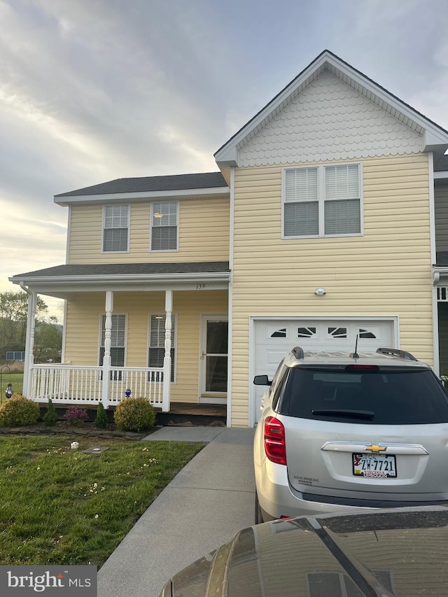 view of front of house with covered porch and a garage