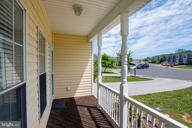 balcony featuring a porch and a residential view
