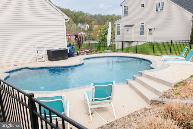 view of pool featuring a patio, fence, and a fenced in pool