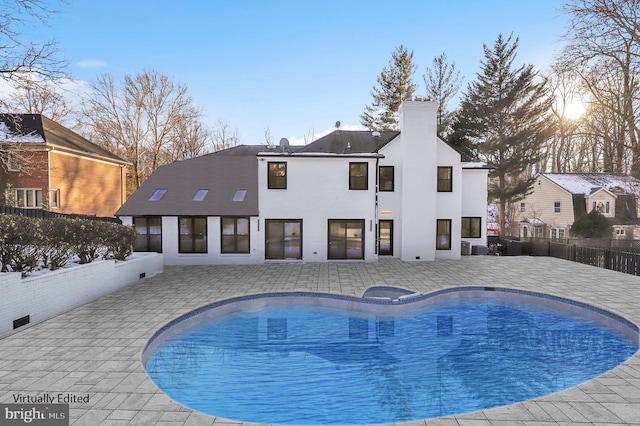 view of swimming pool with a patio, fence, and a fenced in pool