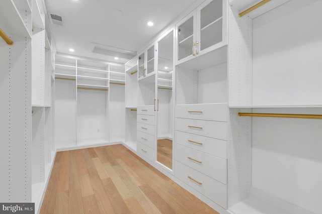 spacious closet featuring light wood-style flooring and visible vents