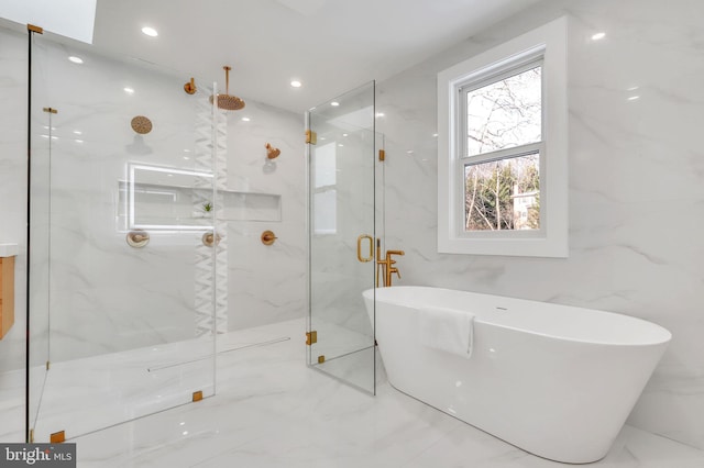 full bathroom featuring recessed lighting, marble finish floor, a freestanding tub, and a marble finish shower