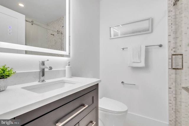 bathroom with vanity, recessed lighting, toilet, and a shower stall