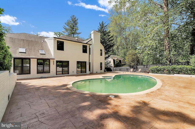 view of pool featuring a patio, fence, and a fenced in pool