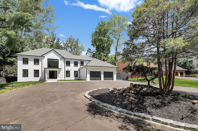 view of front of home featuring an attached garage and driveway