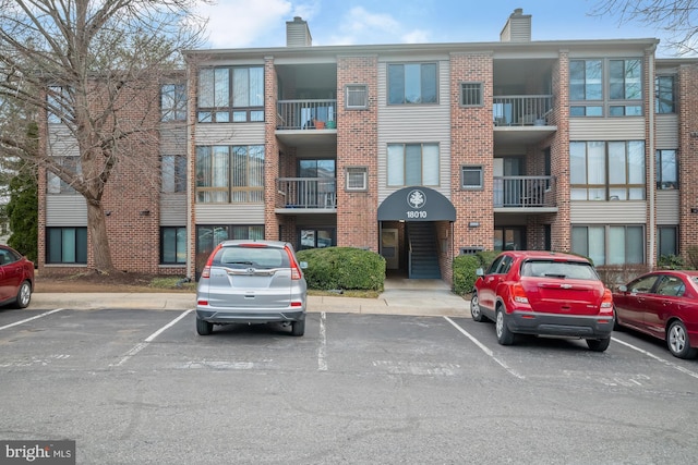 18010 Chalet Dr Unit 18-104, Germantown, MD 20874 - view of property featuring uncovered parking