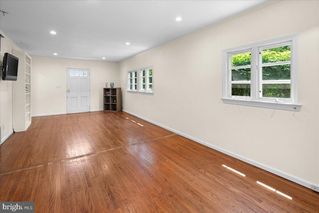 1330 Great Rd, Princeton, NJ 08540 - unfurnished living room with wood finished floors, baseboards, built in shelves, and recessed lighting
