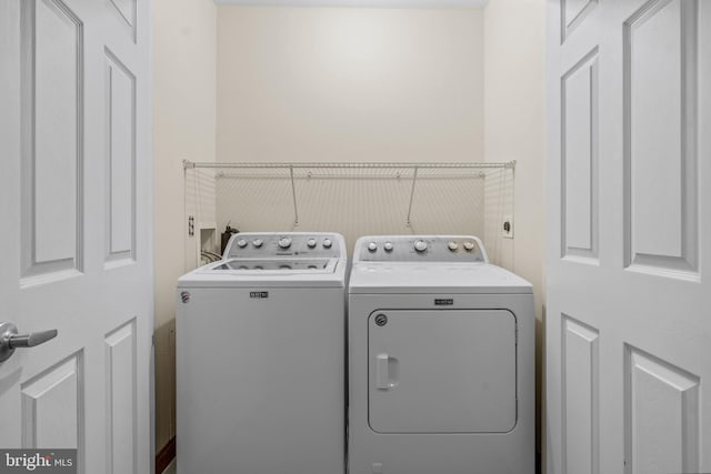 laundry room featuring laundry area and washing machine and clothes dryer